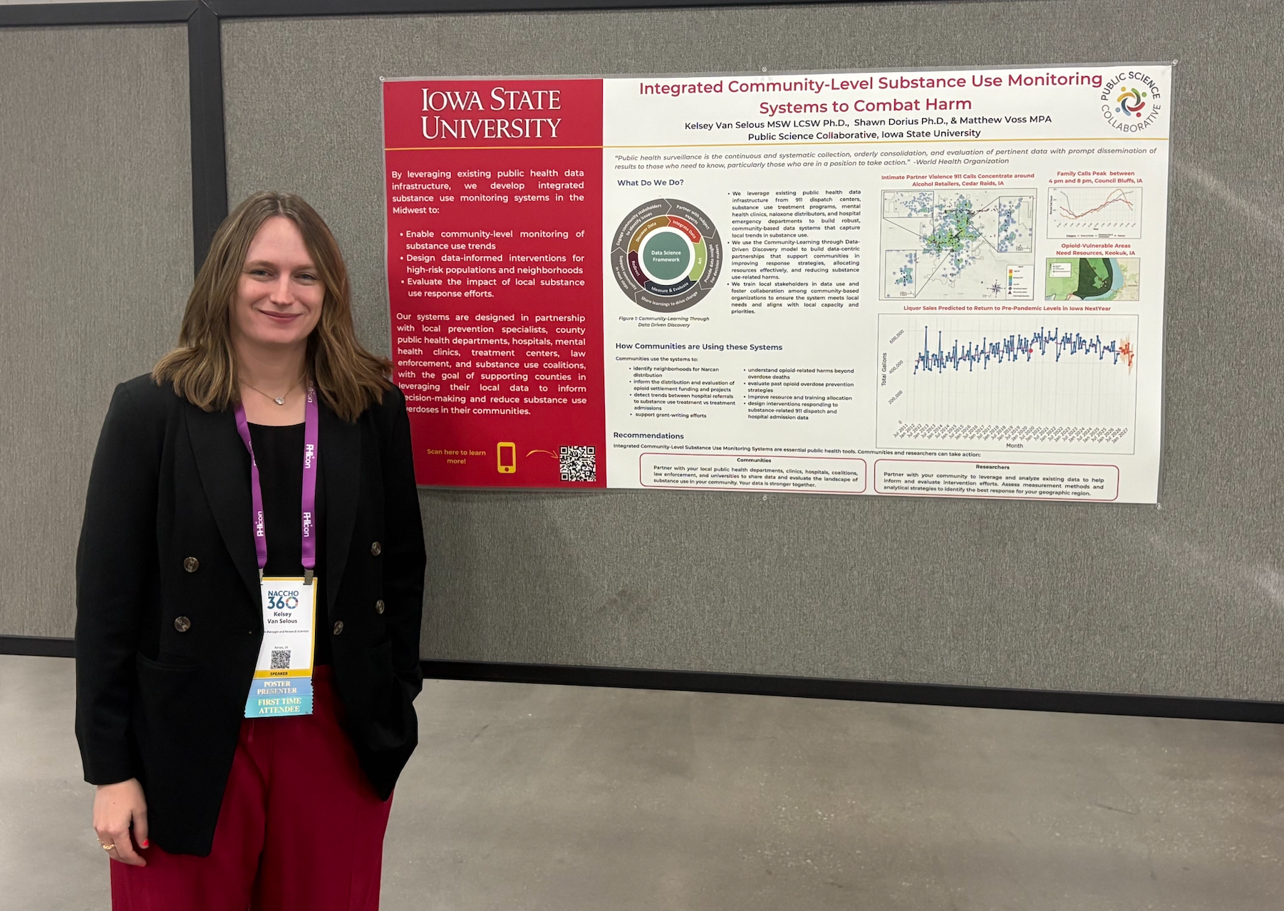 Kelsey standing next to a research poster at NACCHO conference
